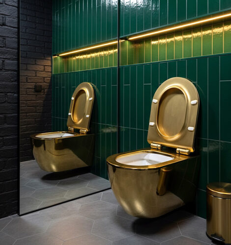 Gold wall hung toilet installed in a restaurant restroom